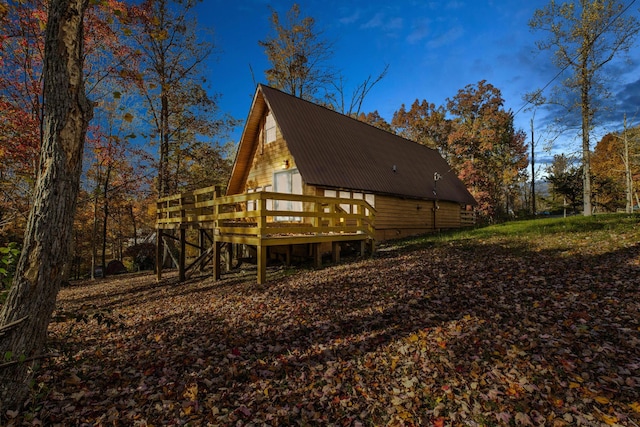 back of house featuring a deck