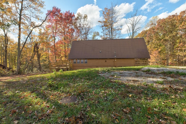 view of side of property with a deck