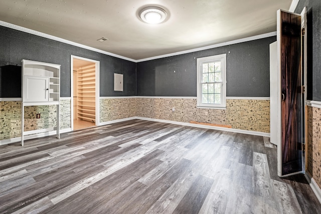 spare room featuring ornamental molding and hardwood / wood-style floors