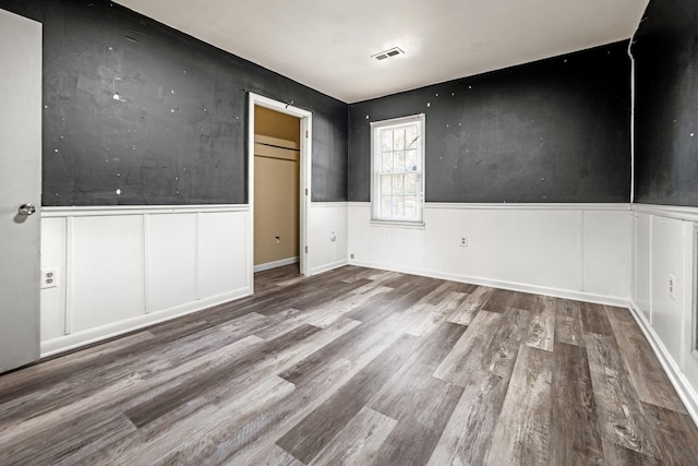 unfurnished room featuring hardwood / wood-style floors