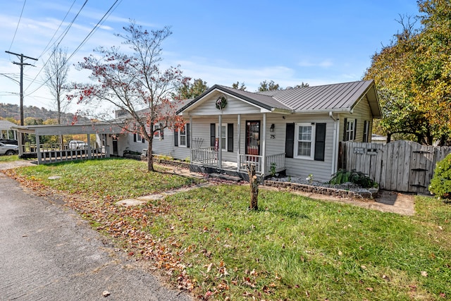 ranch-style home with a carport, a front lawn, and a porch