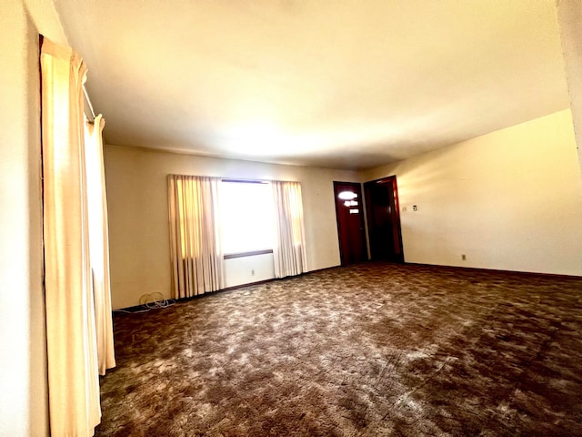 unfurnished room featuring carpet floors