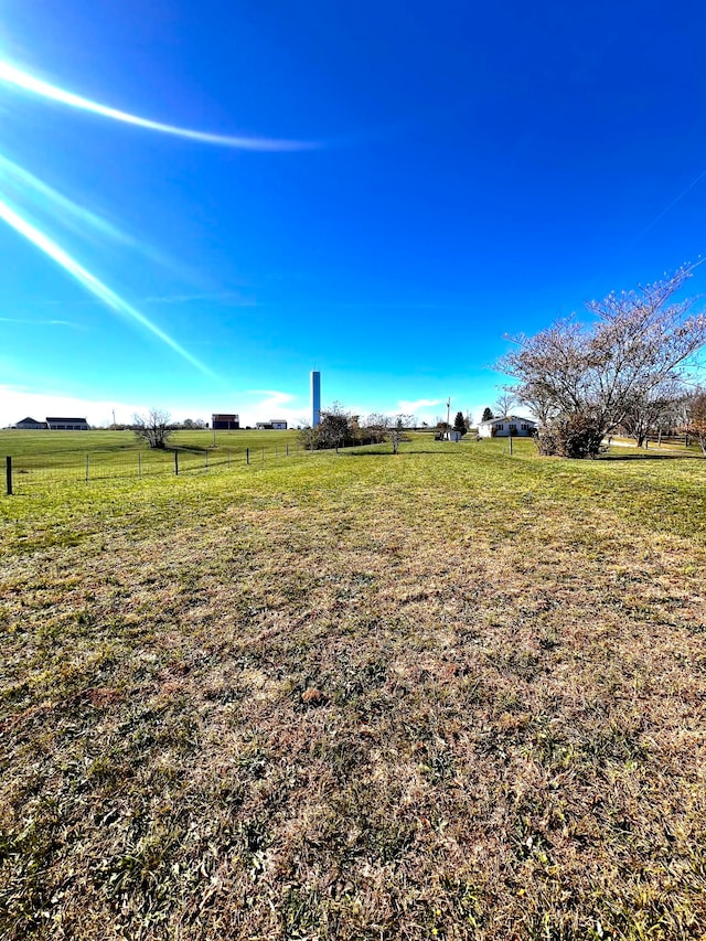 view of yard with a rural view