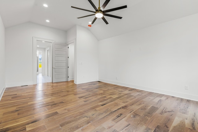 unfurnished living room featuring lofted ceiling, hardwood / wood-style floors, and ceiling fan