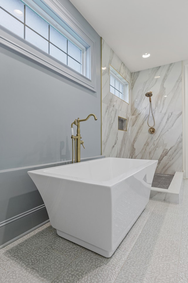 bathroom featuring sink, separate shower and tub, and tile patterned flooring