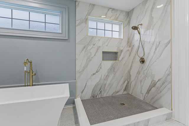 bathroom featuring separate shower and tub and a wealth of natural light