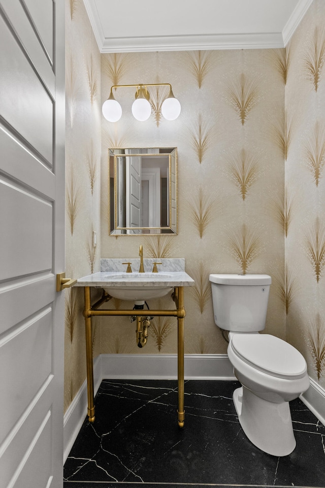 bathroom with toilet, ornamental molding, and tile patterned floors