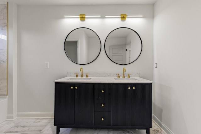 bathroom featuring vanity and a tub