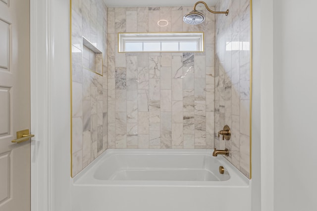 bathroom featuring tiled shower / bath combo