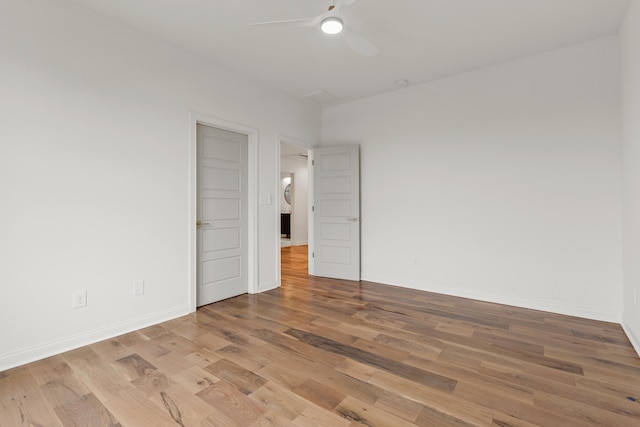 spare room with light hardwood / wood-style flooring and ceiling fan