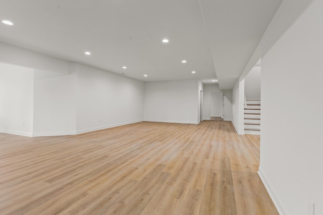 unfurnished living room with light hardwood / wood-style flooring