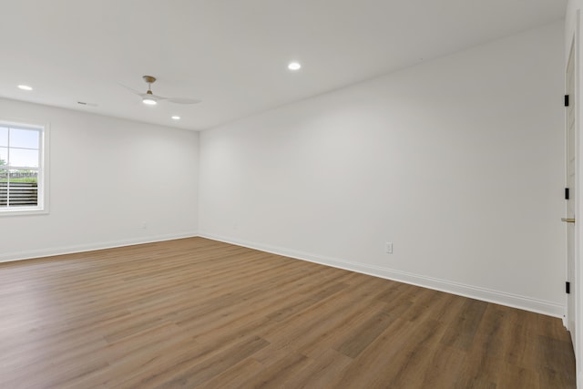 spare room featuring ceiling fan and hardwood / wood-style floors