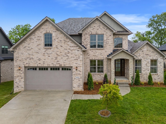 view of front facade with a front lawn and a garage