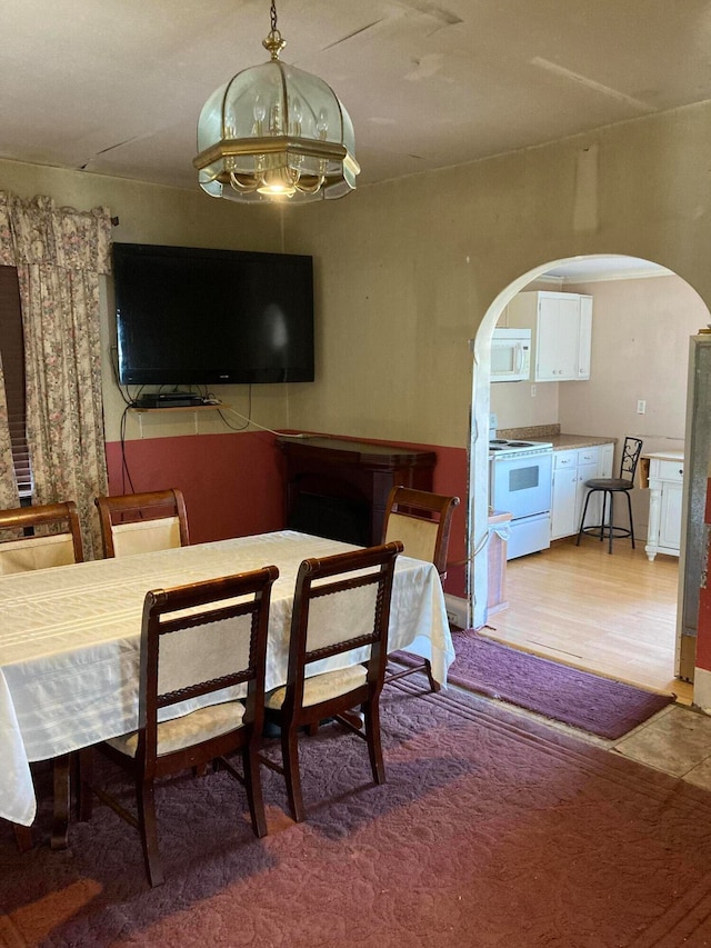 dining space with hardwood / wood-style floors