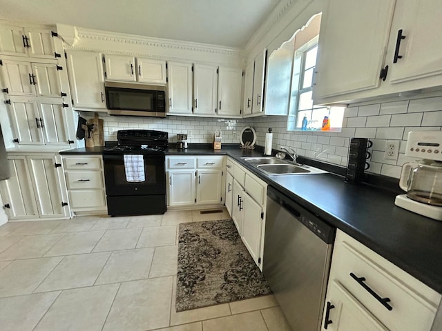 kitchen featuring sink, ornamental molding, stainless steel appliances, decorative backsplash, and light tile patterned floors