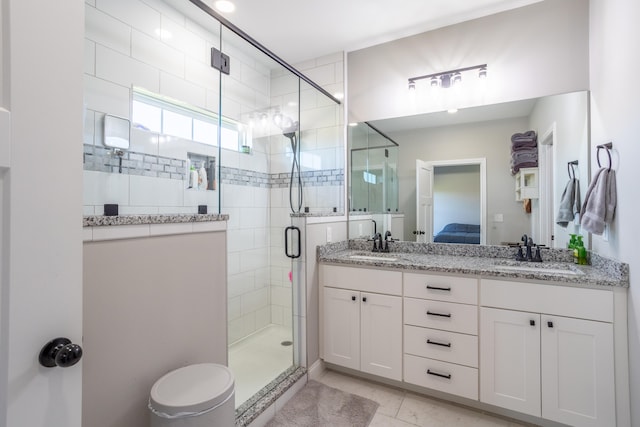 bathroom with vanity, tile patterned floors, and walk in shower