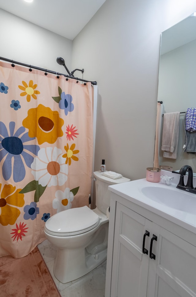 bathroom with vanity, a shower with curtain, and toilet