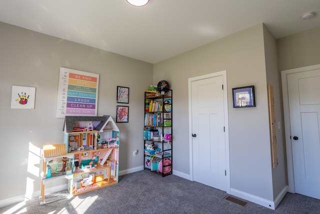 playroom with dark colored carpet