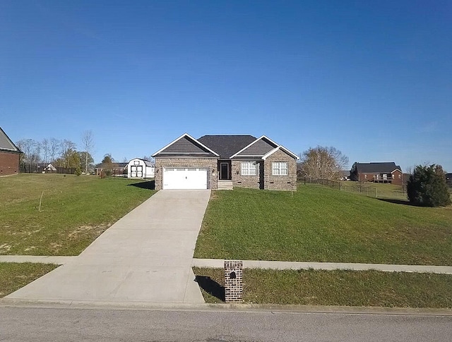 view of front of home with a front lawn and a garage