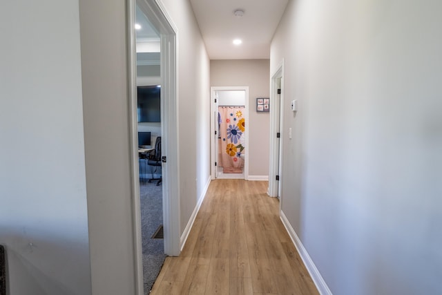 hall with light wood-type flooring