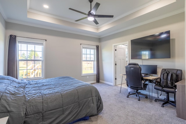 bedroom with crown molding, ceiling fan, multiple windows, and light colored carpet