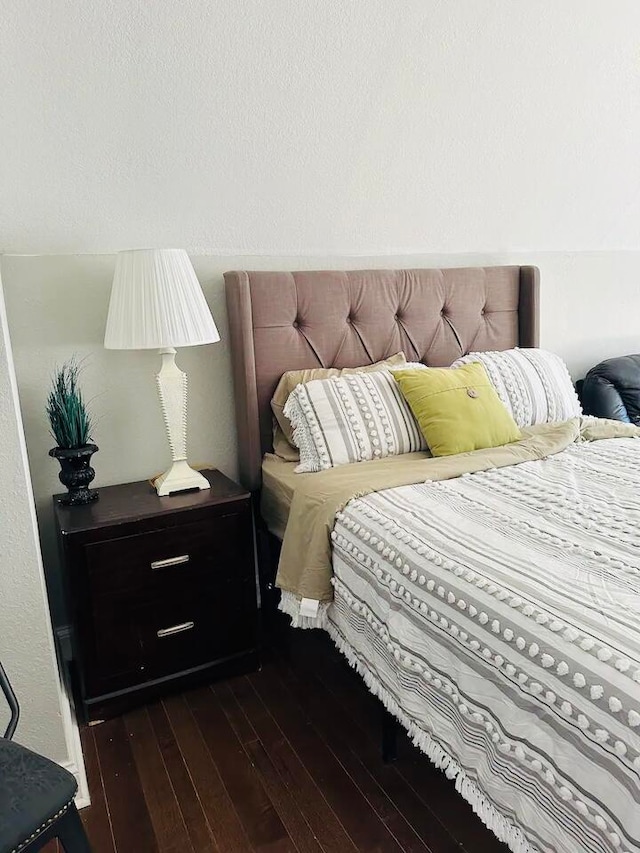 bedroom featuring dark hardwood / wood-style floors