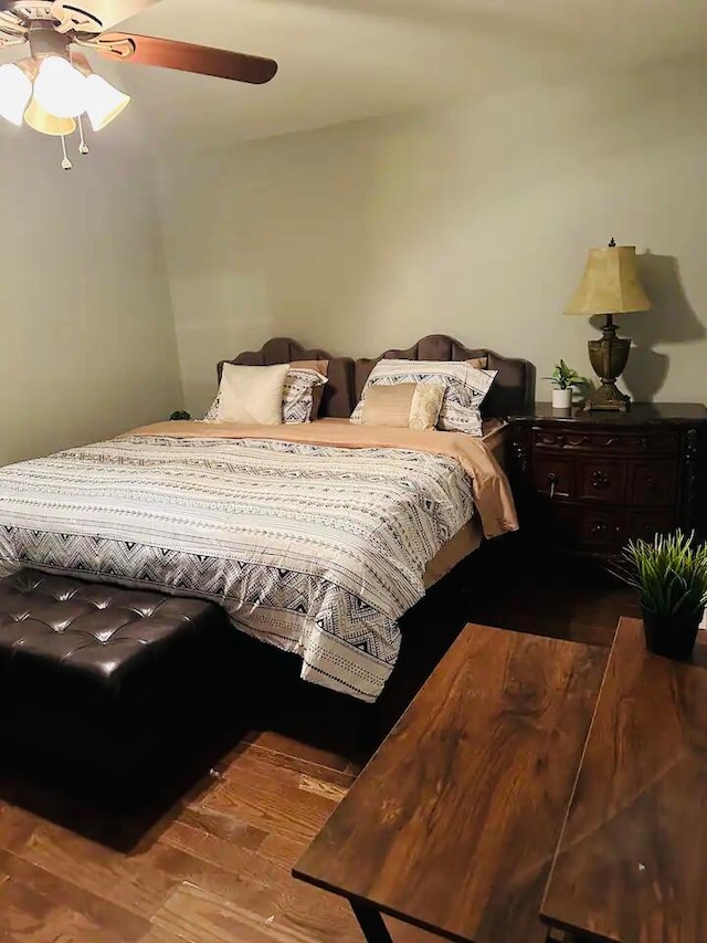 bedroom featuring hardwood / wood-style flooring and ceiling fan