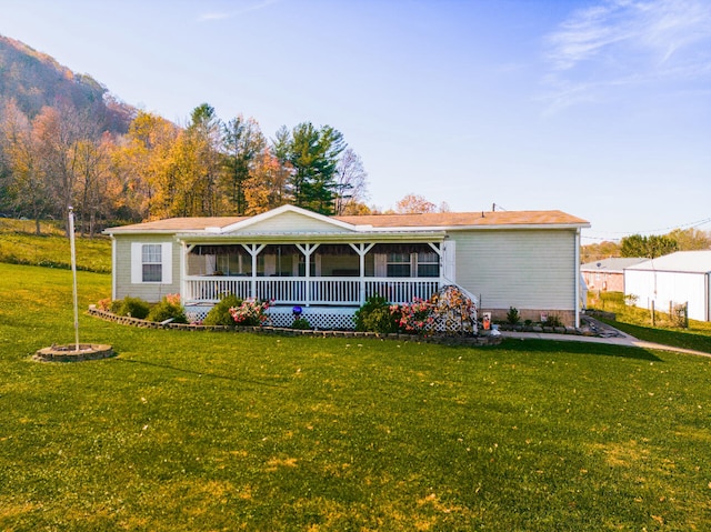 view of front of home featuring a porch and a front yard