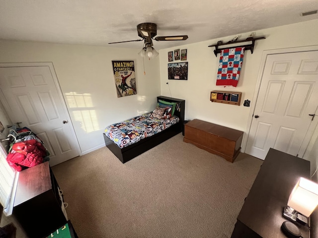 carpeted bedroom featuring ceiling fan