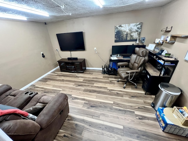 office featuring a textured ceiling and hardwood / wood-style flooring