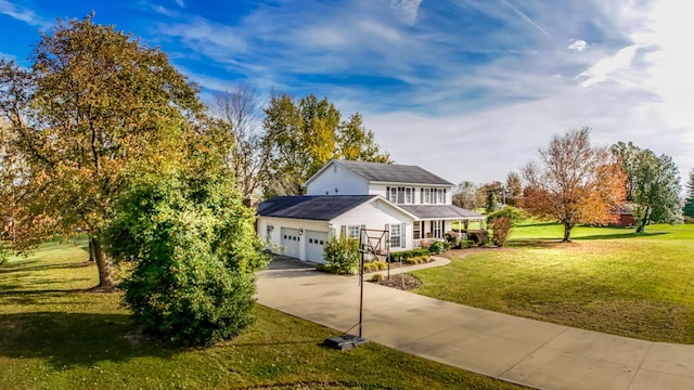 view of front of house with a garage and a front yard