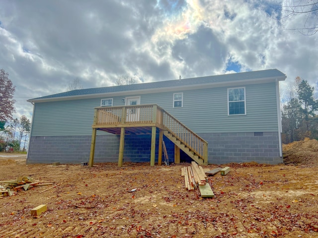 back of property featuring a deck