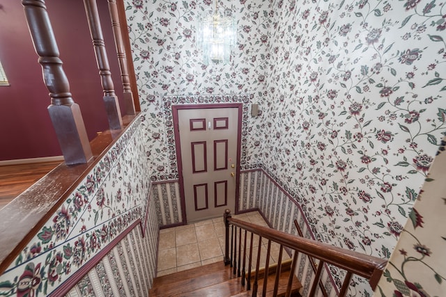 staircase with hardwood / wood-style flooring