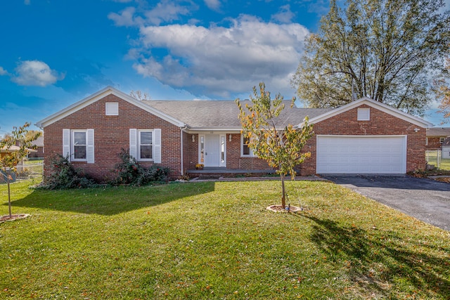 single story home with a front lawn and a garage