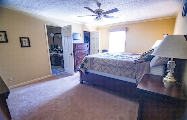 bedroom featuring light carpet, ensuite bathroom, ceiling fan, a textured ceiling, and crown molding