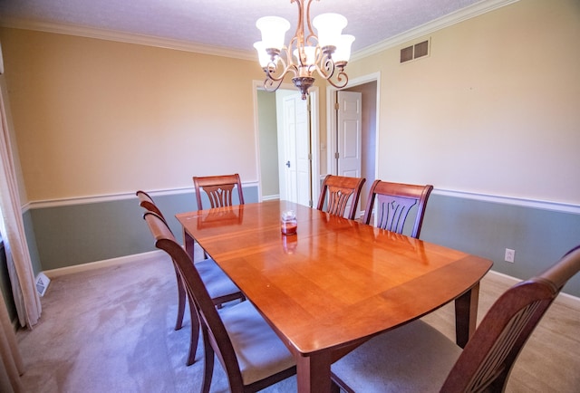 carpeted dining area with ornamental molding, a notable chandelier, and a textured ceiling