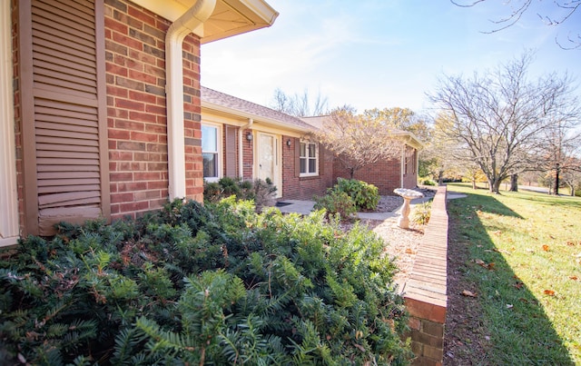 view of property exterior featuring a yard