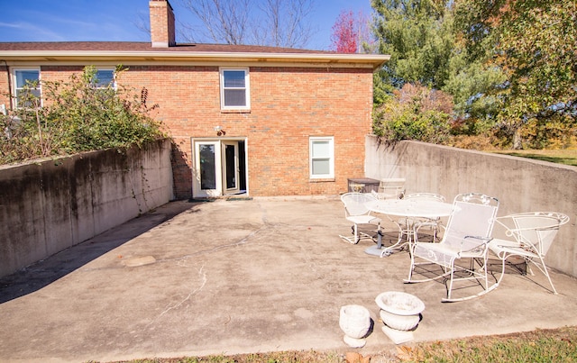 back of property with a patio