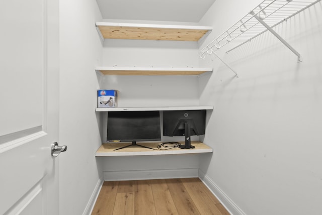 walk in closet featuring wood-type flooring