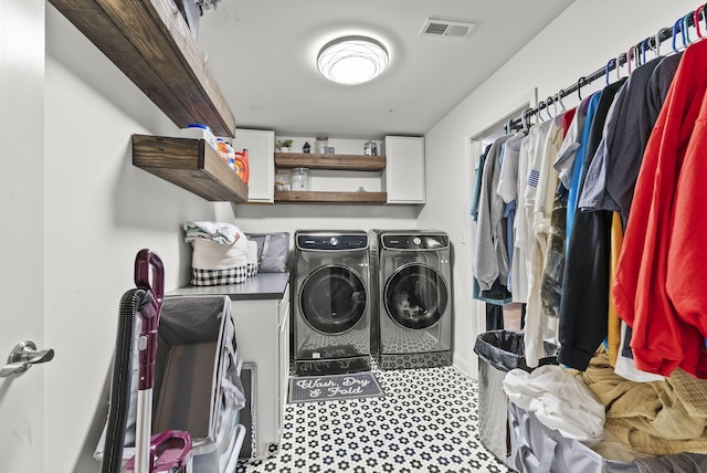 laundry area with washing machine and dryer