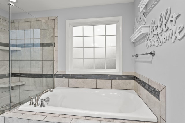 bathroom with separate shower and tub