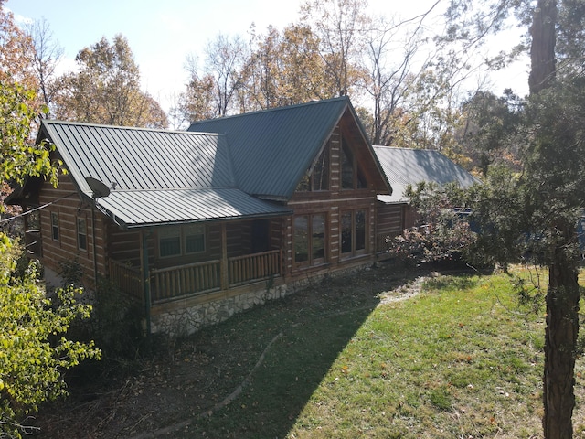 rear view of house with a yard