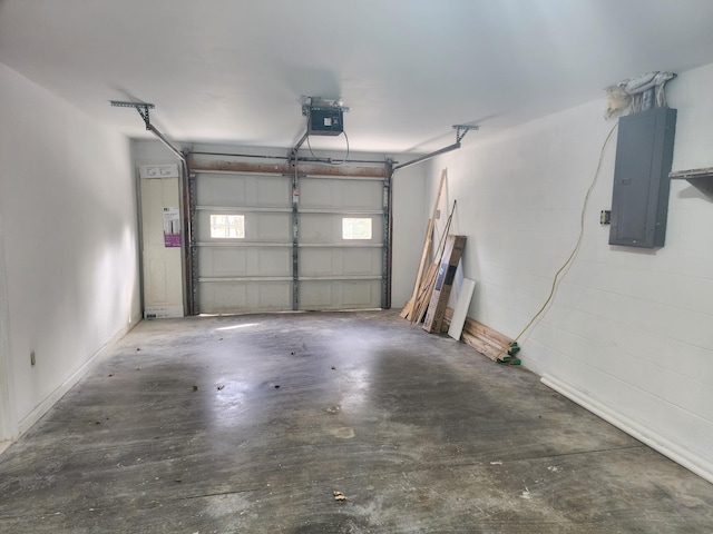 garage featuring electric panel and a garage door opener