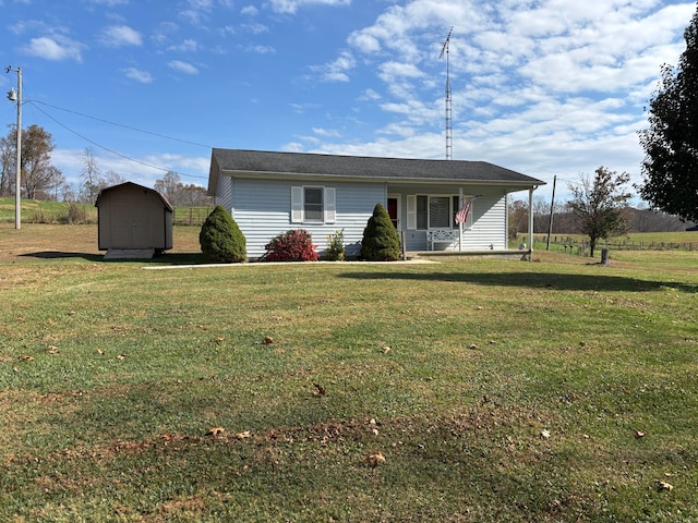 ranch-style house with a front lawn and a shed