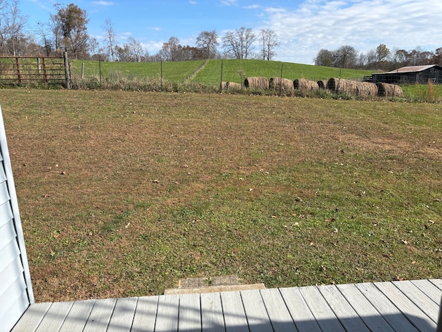 view of yard with a rural view