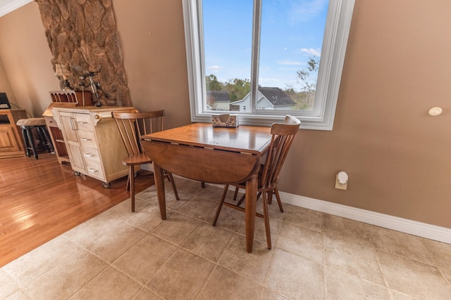 dining space with light hardwood / wood-style flooring