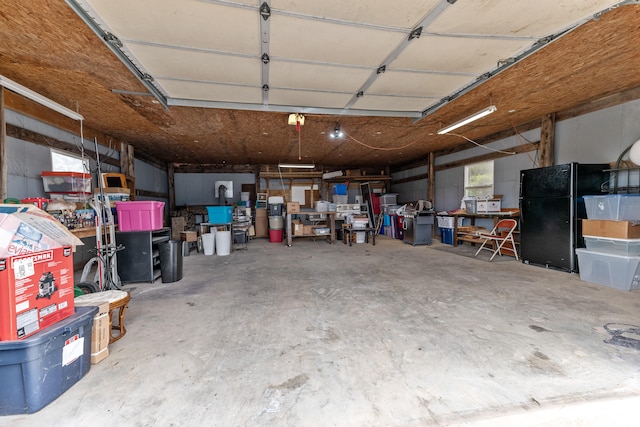 garage with black refrigerator