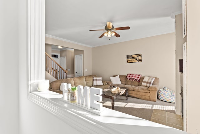 carpeted living room featuring ceiling fan and crown molding