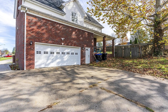 view of property exterior featuring a garage