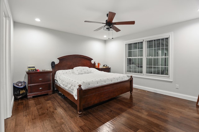 bedroom featuring ceiling fan and dark hardwood / wood-style floors